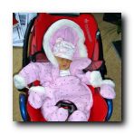 This is the shameful way my parents transported me home! I mean, the suit is just too big for me! Come on!