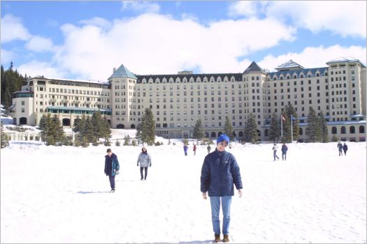 Me standing on frozen Lake Louise in front of hotel