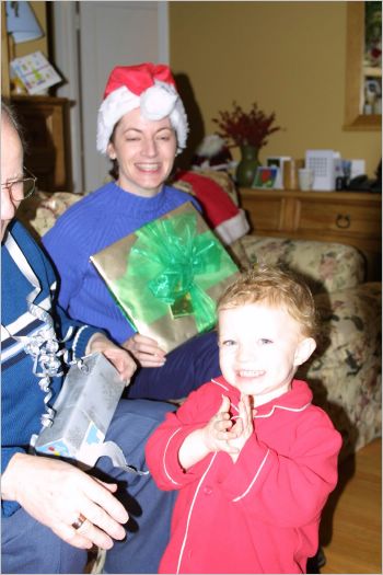 Gavin hands out the pressies and claps his hands!