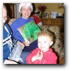 Gavin hands out the pressies and claps his hands!
