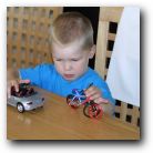 Kyle happily playing cars