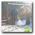 Not a very clear picture but I recall Kyle simply falling backwards with the shovel still in his hand. It didn't hurt as he was so well padded and he couldn't stop laughing. He just lay there laughing until I picked him up. 