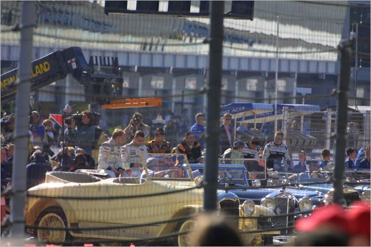 The Formula 1 team mates are ready to do a vintage car lap. 