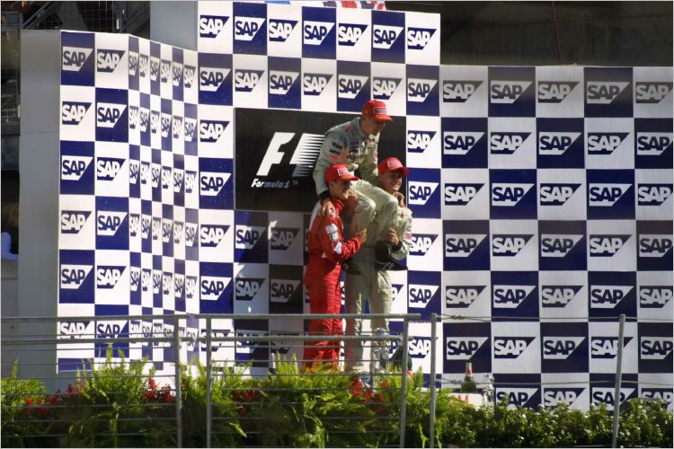 The boys hold up the winner on his last race before retirement.