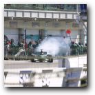 Eddie Irvine kicks up some exhaust fumes!