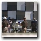 Following September 11th, all of the drivers were protected by State Troopers. Here Coulthard acts as he doesn't notice! He thinks he is cool!