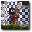 The boys hold up the winner on his last race before retirement.