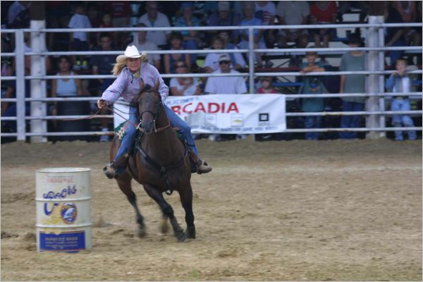 The Cowgirls demonstrated their horseback skills by running to the clock around three barrels. Boy did they race hard - look at this girl's determination!