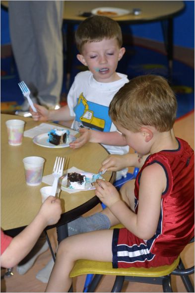 Gavin and Timmy eat birthday cake