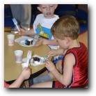 Gavin and Timmy eat birthday cake