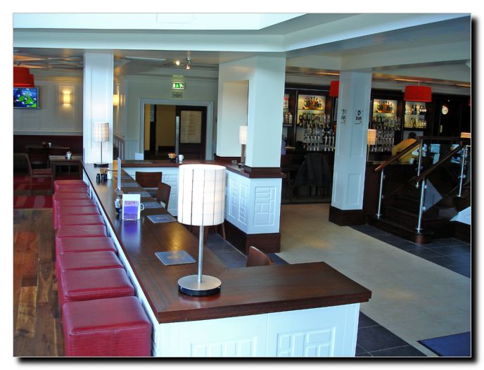 Ground floor Bar looking from front of building where there are tall windows. Great light here.