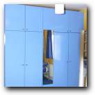 Aluminium handles against Achill blue paint - what a transformation. See reflection of curtains in wardrobe mirror. The curtains match the bed linen. We also added a dimmer switch to the ceiling light with a neutral drop shade to match the window blind. 