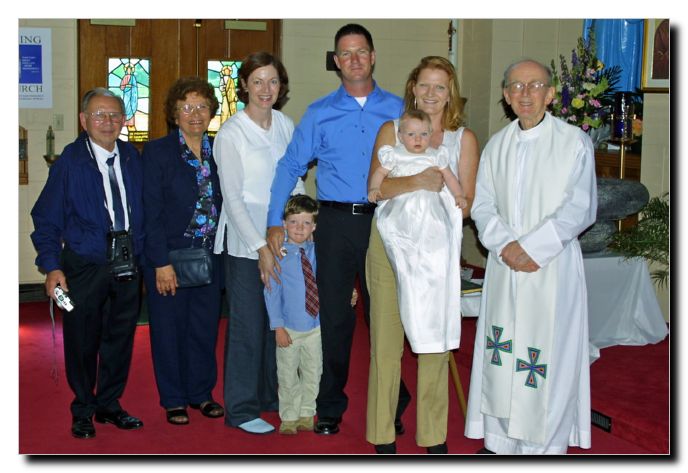 LtoR Sammy, Juisa, Lala, Gavin, Dad, Mom, Me and the Priest that christened me