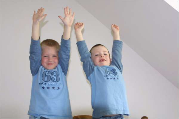 Trying to get as high as they can while jumping on the bed