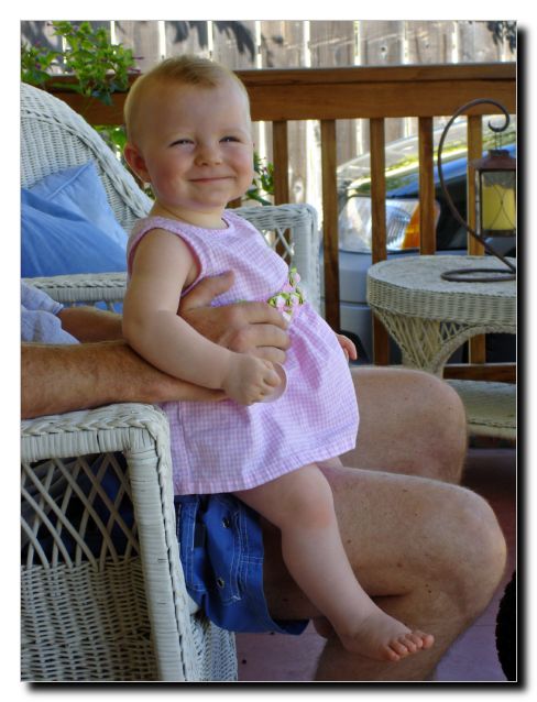 All smug sitting on her daddy's knee