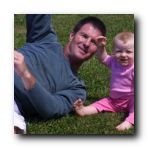 Rylie's first time to sit on grass and she wasn't too sure about it. Get me outta here Dad!